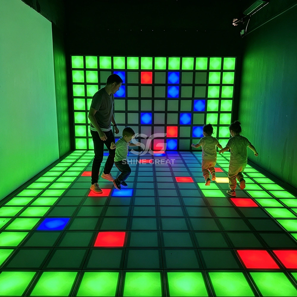 Kids playing Jumping Grid interactive LED floor game in family entertainment center